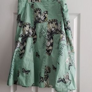 Green skirt with butterfly pattern